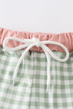Green plaid boy swim trunks