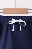Navy scallop hem bow skort