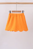 Orange scallop hem bow skort