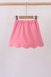 Deep pink scallop hem bow skort