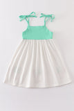Green character applique strap dress